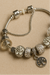 <h3>Pulsera con Charms Plata Tibetana</h3><b>JOYFULLNESS</b>